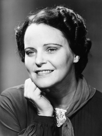 Mature Woman Posing in Studio, Smiling, (B&W), Portrait